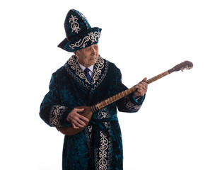 old Kazakh in national clothes, musical instrument dombra, old man, aksakal