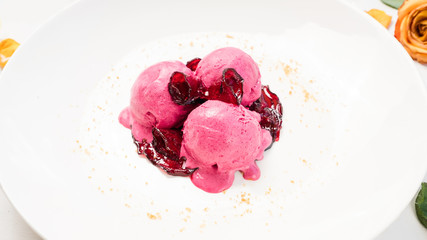 delicious refreshing pink ice cream balls concept. cold restaurant dessert. sweets for children