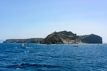 Fototapeta na wymiar Rocky islands of Santorini Greece in summer.