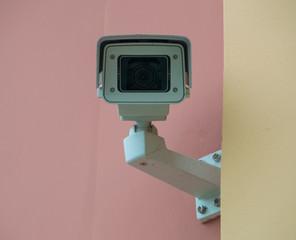 surveillance camera on a building wall, close-up