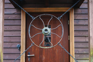 door hangs in front of the iron circle with accessory
