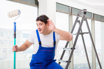 Painter repairman working at construction site
