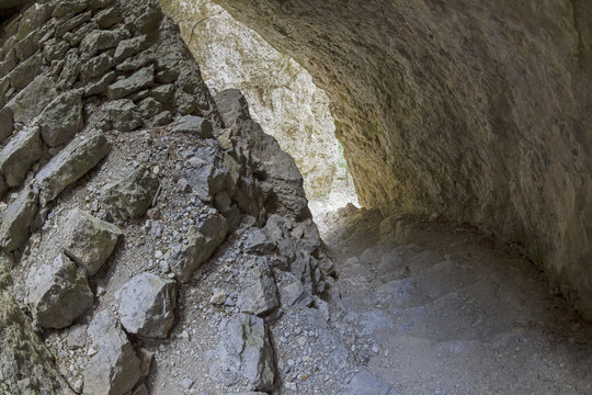 Spiral staircase in the crevice of the rock.