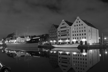  night shots of historic, beautifully lit buildings reflecting in calm water