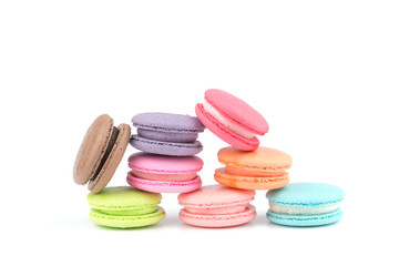 Sweet French macaroons cake (or macarons) with multicolored isolated on white background.
