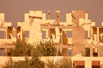 Ruined abandoned building. Bombed building ruins. Old ruined building.
