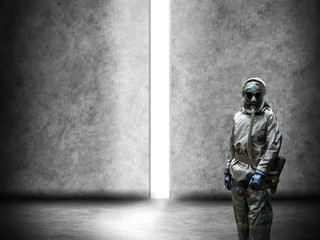 Fototapeta na wymiar Scientist dosimetrist (radiation supervisor) in protective clothing and gas mask