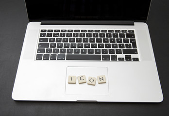 Virtual currency called icon written with letters on a modern laptop. Crypto currency concept image.