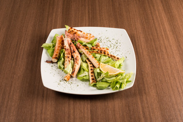 octopus with lemon and salad