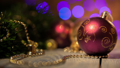 Bordeaux Christmas ball with a pattern on the background bokeh