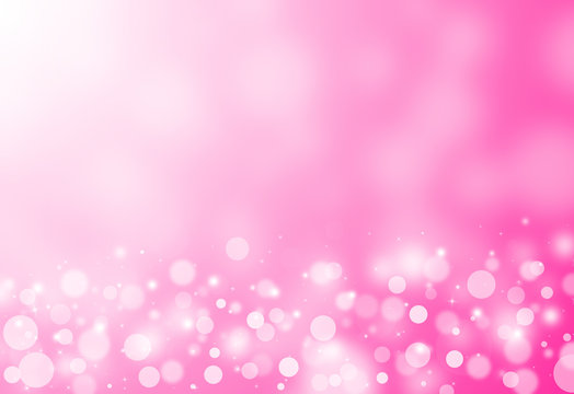 Pink glitter sparkles rays lights bokeh festive elegant abstract background.