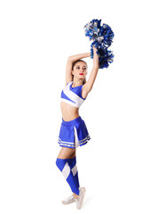 Young cheerleader in blue and white suit with pompoms on white background.