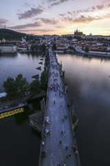 sunset view of Prague castle and Charles Bridge