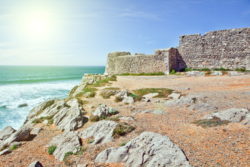 Cliffs and rocks on the Atlantic ocean coast in Sintra in a beautiful summer day. Portugal