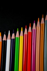 Color pencils on black background
