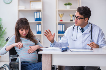 Pregnant woman visiting doctor for consultation