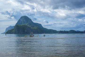 Fototapeta na wymiar El Nido beautiful Cadlao island view with bangka boats in Palawan island, Philippines