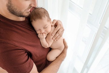 Fototapeta premium Father with cute little baby at home
