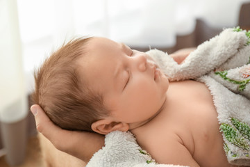 Cute little baby with father at home