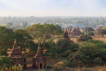 Scenic view of many temples, pagodas and other buildings at the ancient plain of Bagan in Myanmar (Burma), in the morning.