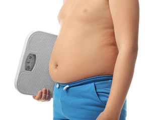 Overweight boy with scales on white background, closeup