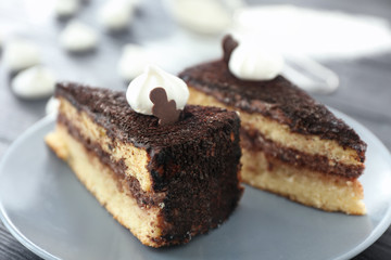Pieces of tasty chocolate cake on plate, closeup