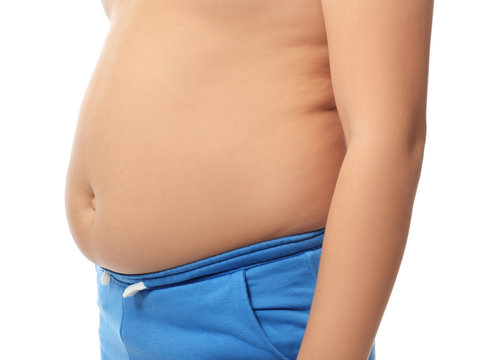 Overweight boy on white background, closeup