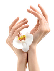 Young woman touching her hand and feeling moisturizing effect of cream on white background