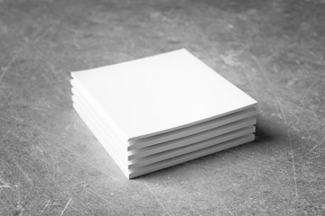 Blank sheets of paper on grey background. Mock up for design
