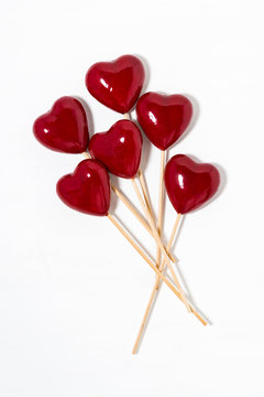 decorative hearts on sticks on a white background, vertical