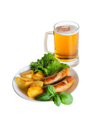 Mug of beer and plate of grilled sausages isolated on white backgound. Selective focus