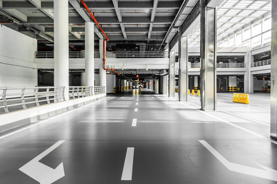 Interior Of Parking Garage With Car And Vacant Parking Lot In Parking Building