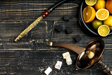 Stylish Smoking hookah and basket with lemon, lime and orange on