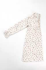 Long sleeve nightgown on white. Fine flower pattern. Cozy and fashionable sleepwear for a little princess.
