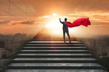 Obraz na płótnie Canvas Businessman superhero pressing virtual buttons on career ladder