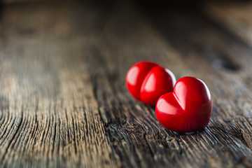 Valentines red heart. One two red heart on wooden table. Wedding or valentine day