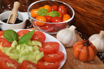 sliced tomatoes with celery, garlic pepper for a healthy snack
