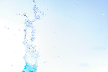 Bottle opening with water splashing isolated on white background.