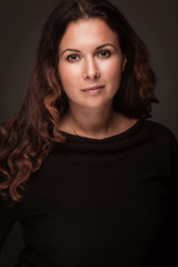 Fototapeta premium Beautiful young woman with curly hair smiling