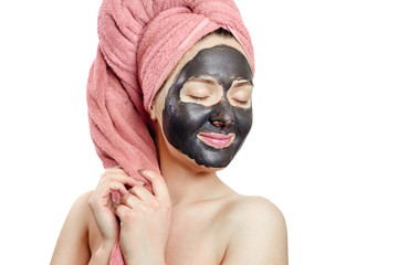 beautiful pretty sexy girl with black face mask on the white background,  close-up portrait, isolated, girl with a pink towel on her head, girl is smiling, black mask on girl's face, enjoys