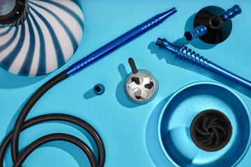 Top view of Hookah parts on light blue background