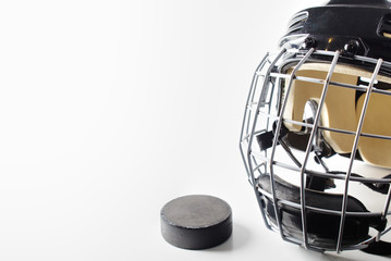 Ice hockey helmet and puck - Powered by Adobe