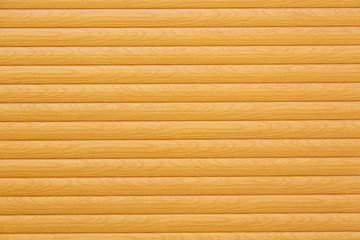 Horizontal wooden planks painted yellow or beige as a background or texture for your design project