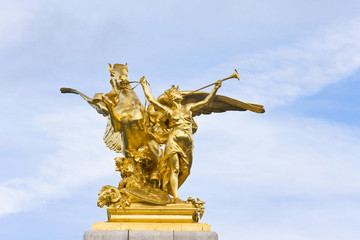 Fototapeta premium Sculpture detail of Fame restraining Pegasus on Pont Alexandre III bridge in Paris France 
