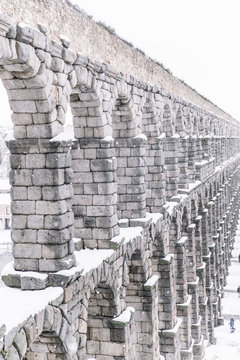 snowy aqueduct of Segovia, Spain