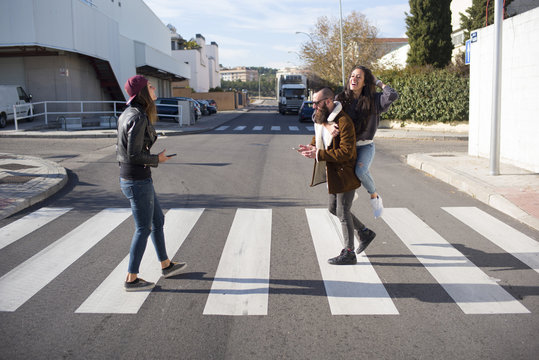 Group of friends at the zebra crossing