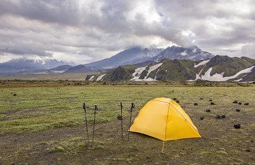 yellow tent near volcanoes of Kamchatka