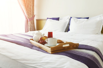 Breakfast served in bed on wooden tray