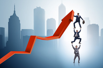 Businessman supporting growtn in economy on chart graph