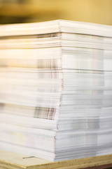 High Contrast, Stack of Printed Paper. Industry Offset Sheets in printing factory.